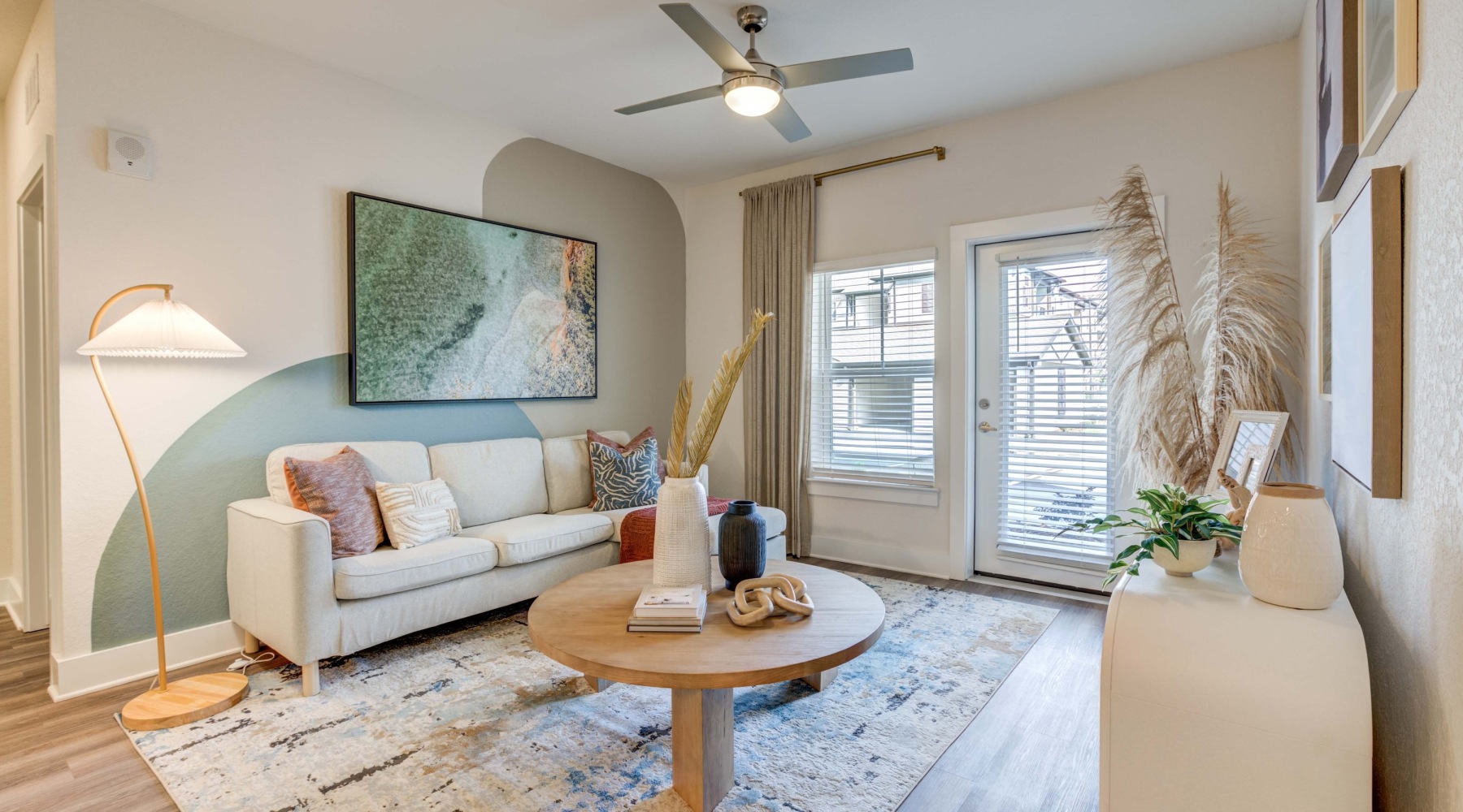 Spacious living areas flooded with natural light living room with a coffee table and cream couch