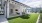 a building with a lawn and tables