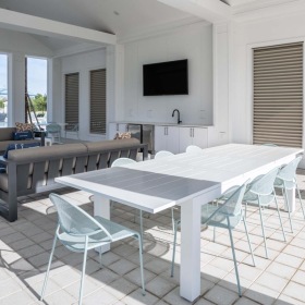Find your perfect fit at Alton Serenoa outdoor patio with a table and a tv