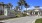 a street with palm trees and buildings