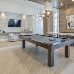 Enjoy our resident-only features a room with a pool table and couches